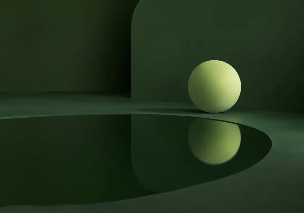 A pale sphere reflected in a still dark pool