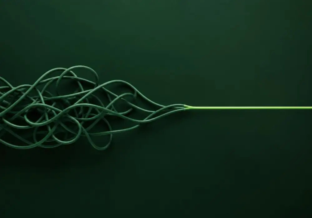 A tangle of green cables resolving into one clean bright line