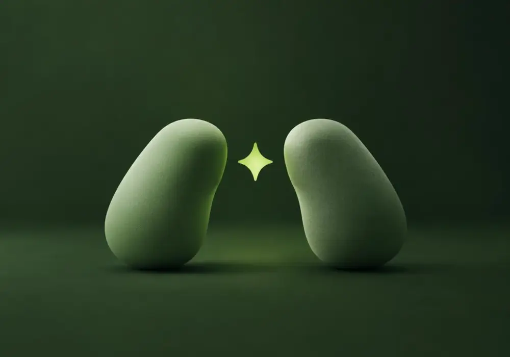 Two soft forms leaning together with a small bright spark between them