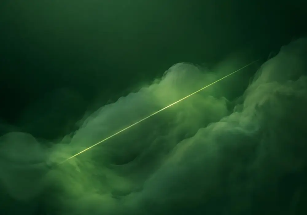 A thin bright line cutting cleanly through green haze