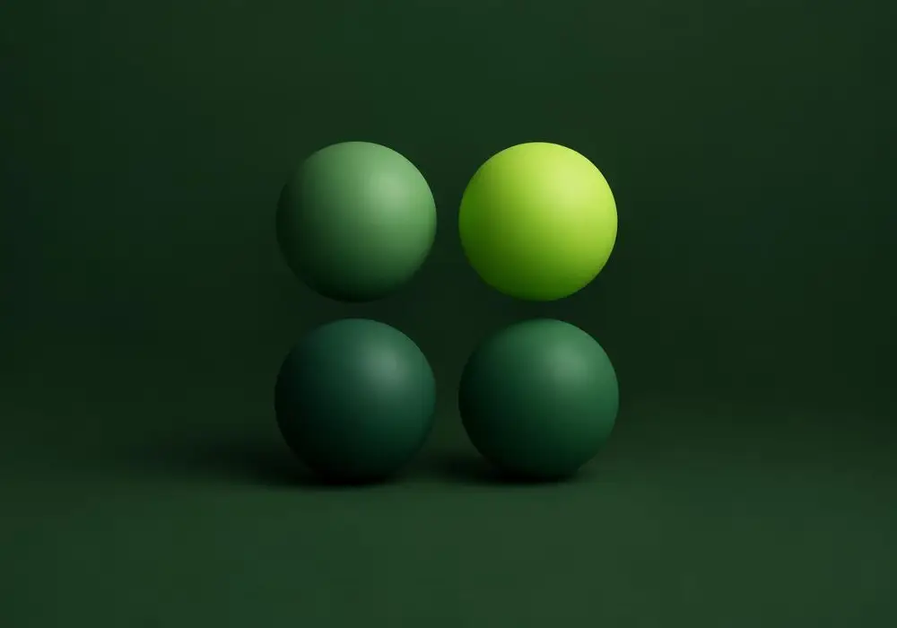 Four spheres grouped evenly, one glowing lime